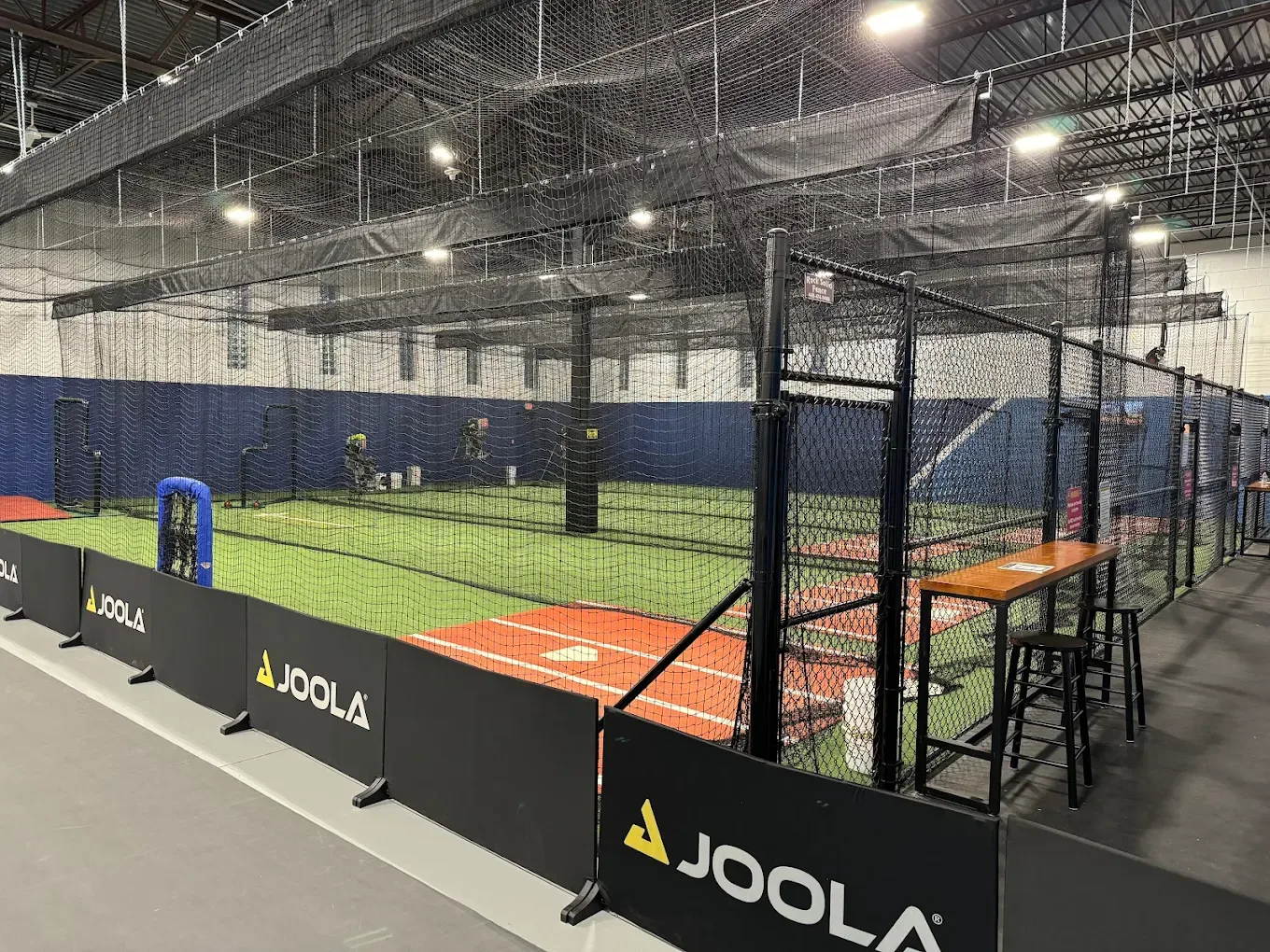 Wide view of indoor batting cages